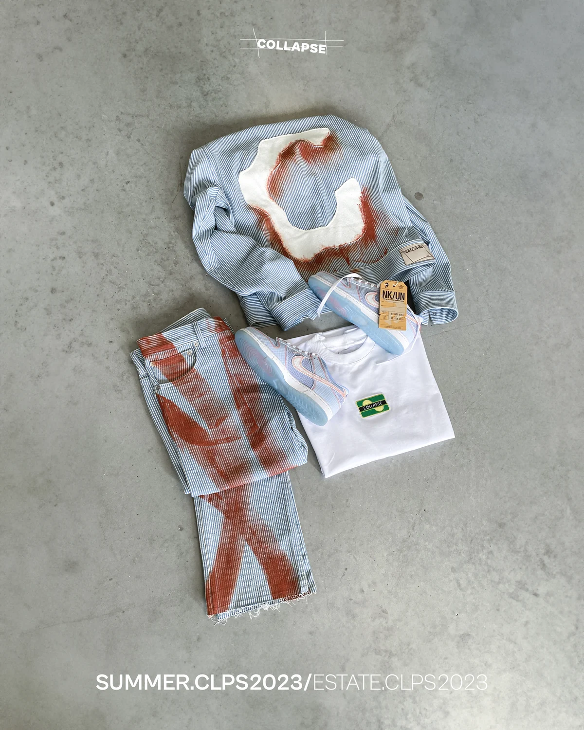 Original composition of Fe26 garments on a concrete surface