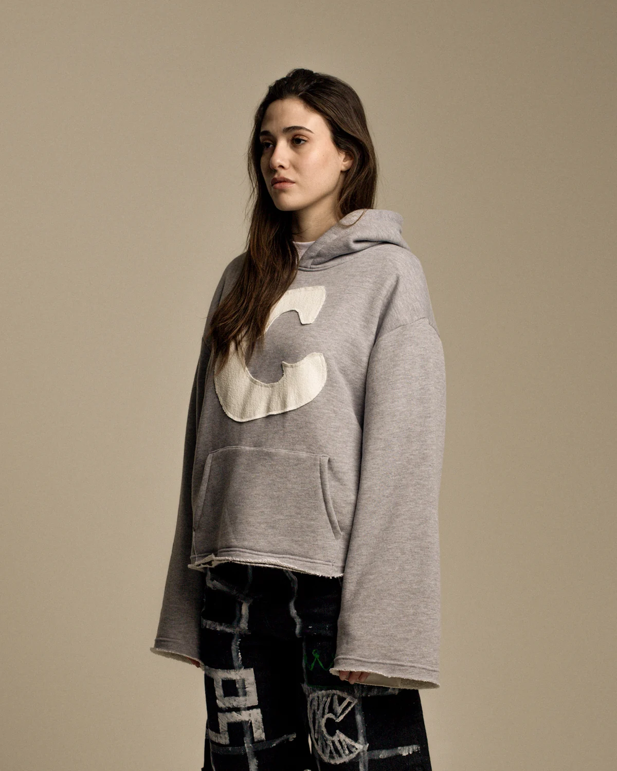Oversized grey hoodie with a large light C