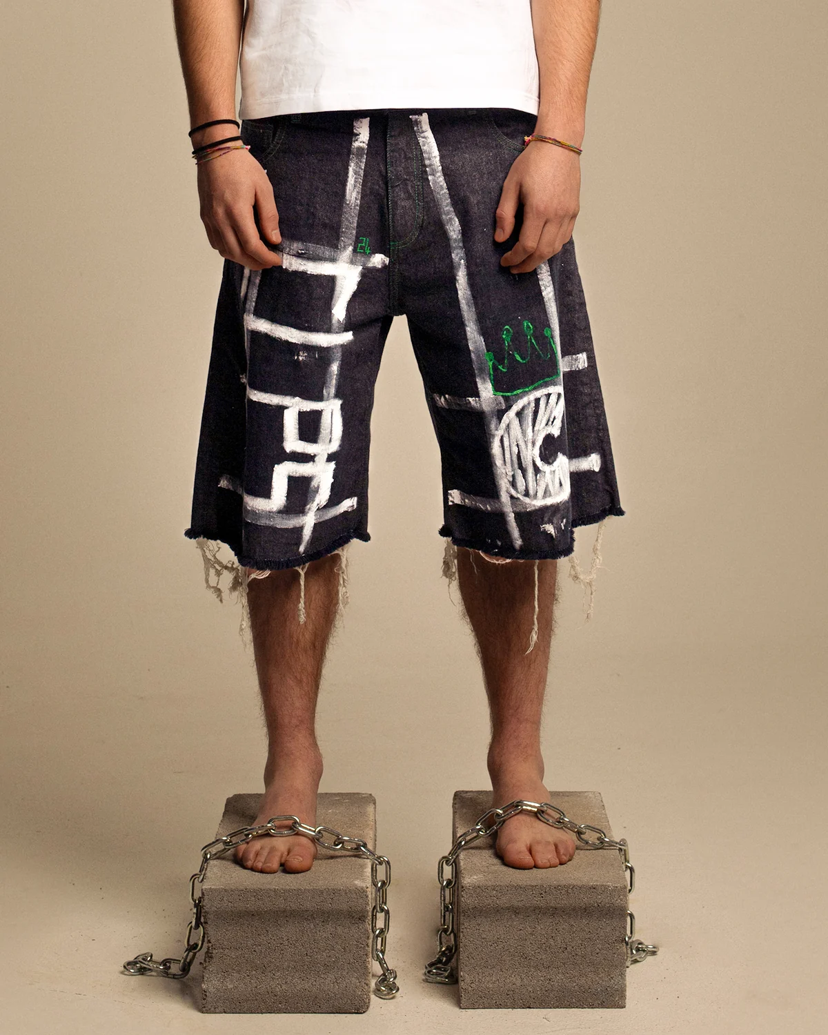 Black shorts with white graphic marks