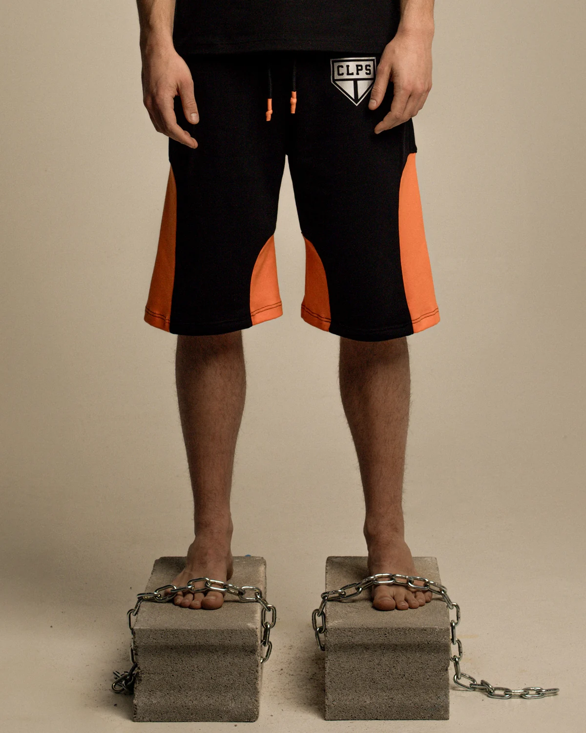 Black and orange COLLAPSE sports shorts