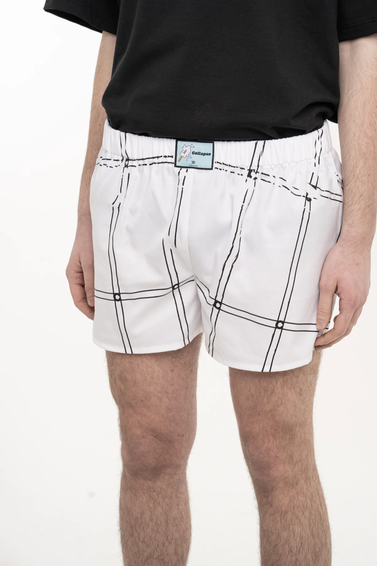 White shorts with black line graphics