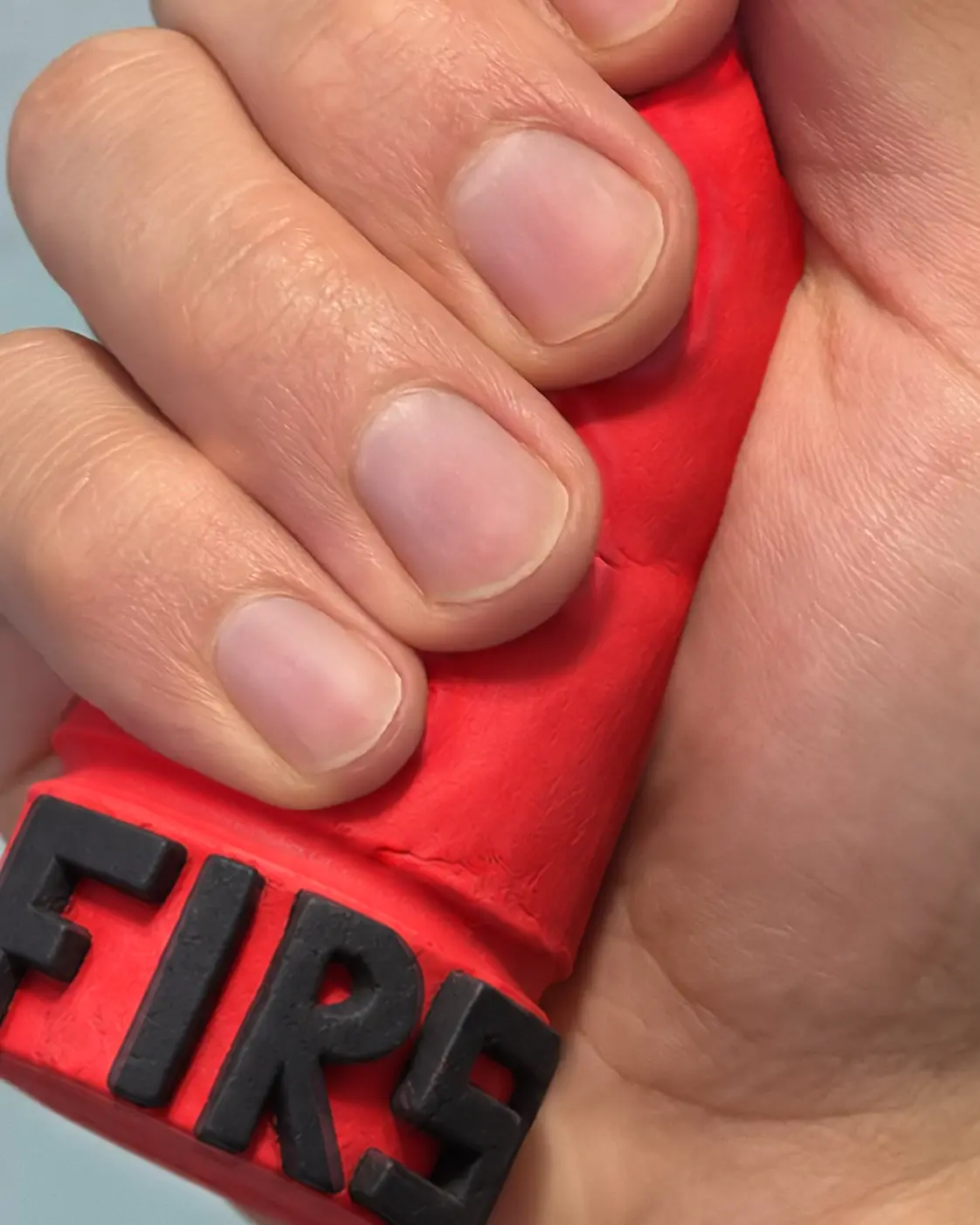 FIRST / hand holding the tactile object
