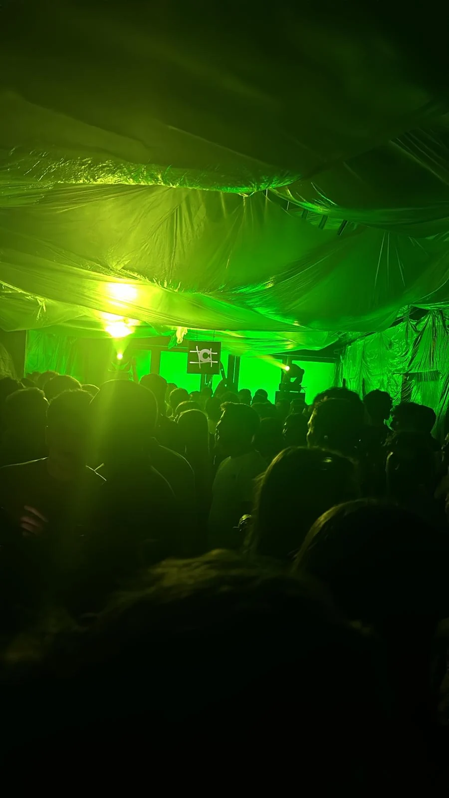 Green lighting and audience during the COLLAPSE party