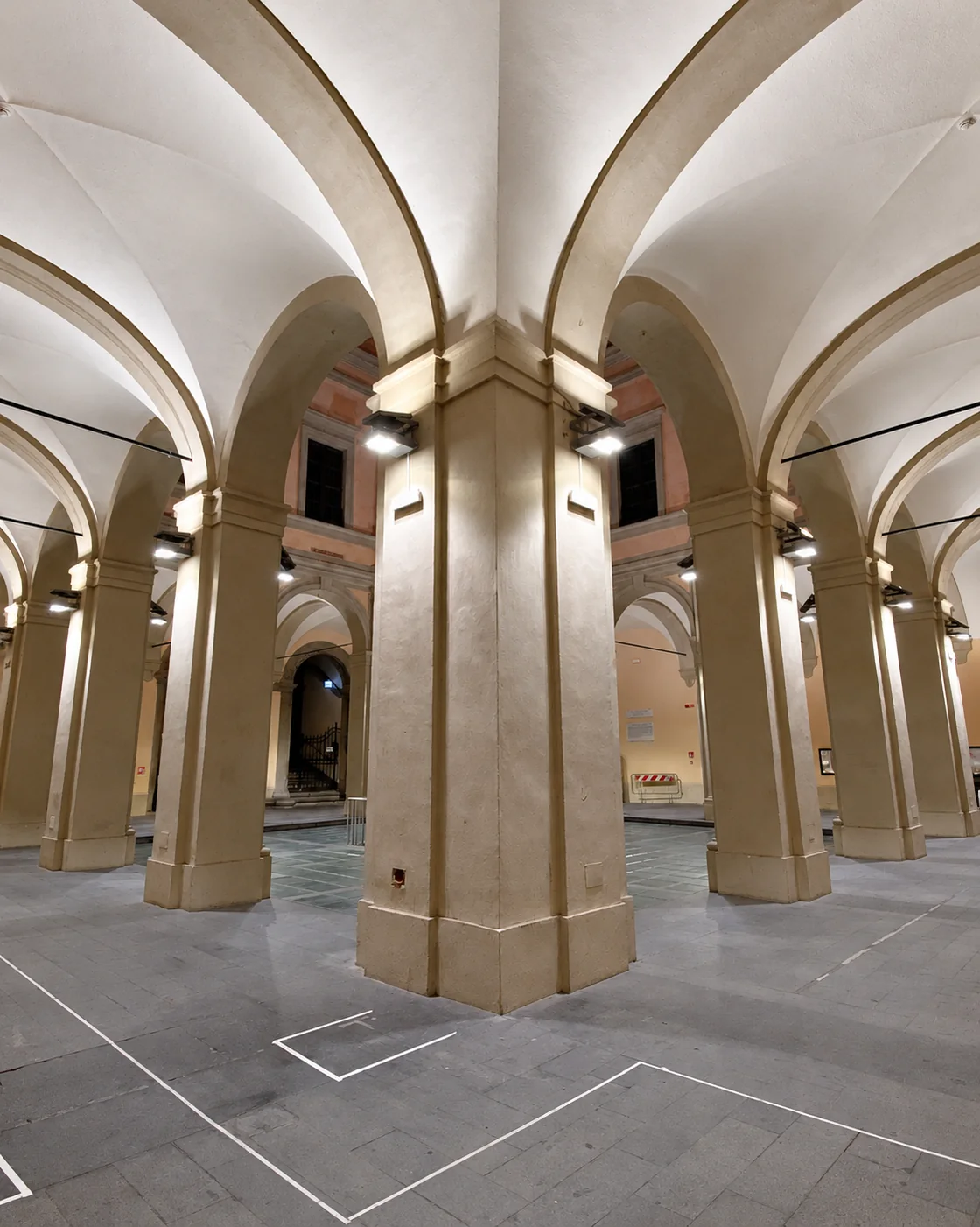 Loggiato vaults and columns with preparation markings on the floor
